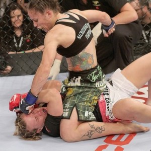 Liz Carmouche (top) looks for a big win in front of fellow military members to move one fight away from title contention Wednesday (Photo Credit/Bleacher Report)