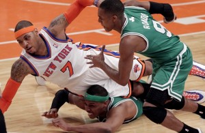 Boston Celtics Rajon Rondo watches New York Knicks Carmelo Anthony fall on Paul Pierce in the first half in the Eastern Conference first round of the NBA Playoffs at Madison Square Garden in New York City on April 22, 2011. The Celtics defeated the Knicks 113-96 and lead the series 3-0.      UPI/John Angelillo